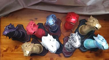 Wall-mounted dragon head trophies